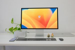 mac studio computer on a white office desk